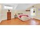 Light and bright bedroom with neutral walls, wood floors, and natural light at 221 Abner Rd, Stony Point, NC 28678
