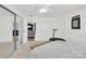 Bedroom with closet doors featuring plenty of natural light, neutral walls and decor at 221 Abner Rd, Stony Point, NC 28678
