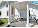 Charming entryway with white columns and a well-maintained walkway at 221 Abner Rd, Stony Point, NC 28678