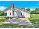 Exterior angle of charming white home with a beautiful green yard at 221 Abner Rd, Stony Point, NC 28678