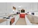 A vintage kitchen featuring a double sink and a window with white cabinets at 221 Abner Rd, Stony Point, NC 28678
