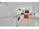 A vintage kitchen with white cabinets, an oven range, and vintage decor at 221 Abner Rd, Stony Point, NC 28678