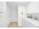 Functional laundry area featuring a washer, dryer, and storage cabinets at 221 Abner Rd, Stony Point, NC 28678