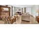 Comfortable living room with hardwood floors, large windows, and a decorative fireplace at 221 Abner Rd, Stony Point, NC 28678