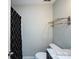 Bathroom features a toilet and sink with marble counter, and black shower curtain at 2502 Breuster Dr, Charlotte, NC 28210