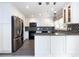 This spacious kitchen features sleek, stainless steel appliances and white cabinets, with modern fixtures and countertops at 2502 Breuster Dr, Charlotte, NC 28210