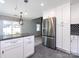 This modern kitchen features granite countertops, stainless steel appliances, and ample cabinet space at 2502 Breuster Dr, Charlotte, NC 28210