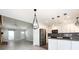 Bright kitchen features stainless appliances, white cabinets, modern fixtures, and stylish black and white backsplash at 2502 Breuster Dr, Charlotte, NC 28210