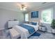 Relaxing main bedroom with cool colors, a large bed, wood-look floors, and large windows at 2502 Breuster Dr, Charlotte, NC 28210