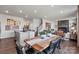 Open-concept dining area with wood table, seamlessly connected to the kitchen and living room at 2585 Blue Sky Meadows Dr, Monroe, NC 28110