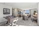 Spacious game room complete with a foosball table, comfortable seating, and a view of the community at 2585 Blue Sky Meadows Dr, Monroe, NC 28110