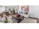 Bright living room featuring stylish furnishings, modern decor, and an open floor plan to the kitchen at 2585 Blue Sky Meadows Dr, Monroe, NC 28110