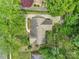 Aerial view of the property featuring the roof, lush greenery, driveway, and surrounding landscape at 2626 Lilly Mill Rd, Charlotte, NC 28210