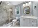 Bathroom features a glass shower, a window for natural light, and modern fixtures at 2626 Lilly Mill Rd, Charlotte, NC 28210