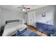 Comfortable bedroom with hardwood floors, a ceiling fan, and closet space at 2626 Lilly Mill Rd, Charlotte, NC 28210