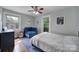 Cozy bedroom with natural light showcases hardwood floors and space for a relaxing blue chair at 2626 Lilly Mill Rd, Charlotte, NC 28210