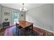 Dining room with wood table, rug, and window at 2626 Lilly Mill Rd, Charlotte, NC 28210