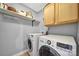Well-equipped laundry room with modern washer and dryer units and storage cabinets at 2626 Lilly Mill Rd, Charlotte, NC 28210