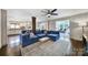 Spacious living room with hardwood floors, a comfortable sectional, and an easy transition to the kitchen at 2626 Lilly Mill Rd, Charlotte, NC 28210