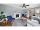 Bright living room with hardwood floors, a stylish fireplace, and comfortable seating arrangement at 2626 Lilly Mill Rd, Charlotte, NC 28210