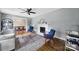 Cozy living room with hardwood floors, a fireplace, and an open layout connecting to the dining area at 2626 Lilly Mill Rd, Charlotte, NC 28210