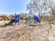 Community playground featuring blue and green playground equipment for outdoor fun and neighborhood gatherings at 2626 Lilly Mill Rd, Charlotte, NC 28210