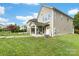 A meticulously maintained backyard featuring lush grass, a patio, and a secure fence is a perfect setting for outdoor enjoyment at 2638 Double Oaks Rd, Charlotte, NC 28206