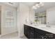 Bathroom showcasing dual sinks, vanity, and natural light at 2638 Double Oaks Rd, Charlotte, NC 28206