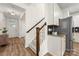 Welcoming entryway with hardwood floors, staircase, and convenient access to the kitchen and living areas at 2638 Double Oaks Rd, Charlotte, NC 28206