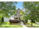 Charming two-story home with a mix of brick and siding, front lawn, and covered porch with steps at 2638 Double Oaks Rd, Charlotte, NC 28206