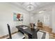 Stylish home office featuring modern desk, elegant chandelier, and beautiful decor at 2638 Double Oaks Rd, Charlotte, NC 28206