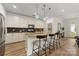 Modern kitchen with stainless appliances, granite countertops, and stylish pendant lighting at 2638 Double Oaks Rd, Charlotte, NC 28206