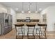 Well-lit kitchen with granite counters, stainless appliances, and a central island with bar seating at 2638 Double Oaks Rd, Charlotte, NC 28206