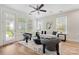 Bright living room featuring hardwood floors, neutral walls, and a stylish seating arrangement with outside views at 2638 Double Oaks Rd, Charlotte, NC 28206