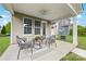 Covered patio with stylish seating and decor, perfect for outdoor relaxation at 2638 Double Oaks Rd, Charlotte, NC 28206