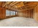 Spacious unfinished room with exposed wood framing, offering potential for customization at 2638 Double Oaks Rd, Charlotte, NC 28206