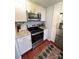 Modern kitchen with stainless steel appliances and granite countertops at 300 S Cedar St # 2, Charlotte, NC 28202