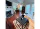 Inviting living room with fireplace, hardwood floors, and an open floor plan at 300 S Cedar St # 2, Charlotte, NC 28202