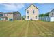 Spacious backyard with well-maintained lawn and privacy fence at property line at 3578 Saddlebrook Dr, Midland, NC 28107