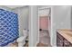 Well-lit bathroom with a combination shower and bathtub with a pink bedroom nearby at 3578 Saddlebrook Dr, Midland, NC 28107
