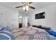Comfortable bedroom featuring a mounted TV and en-suite bathroom, providing private relaxation at 3578 Saddlebrook Dr, Midland, NC 28107