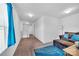 Upstairs bonus room with couch and blue accent pillows at 3578 Saddlebrook Dr, Midland, NC 28107
