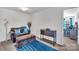 Bonus room with sitting area and doorway to an adjacent bedroom at 3578 Saddlebrook Dr, Midland, NC 28107