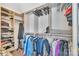 Walk-in closet with lots of built in storage space and hanging clothes at 3578 Saddlebrook Dr, Midland, NC 28107
