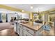 Spacious kitchen with granite countertops island and stainless appliances, opens to a dining area and living room at 3578 Saddlebrook Dr, Midland, NC 28107