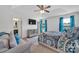 Spacious main bedroom with a sitting area, tray ceiling, a TV, and ensuite bathroom at 3578 Saddlebrook Dr, Midland, NC 28107