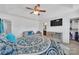 Comfortable main bedroom with a sitting area, tray ceiling, a TV, and closet at 3578 Saddlebrook Dr, Midland, NC 28107