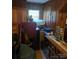 A bedroom featuring wood paneling and a window at 3712 Avalon Ave, Charlotte, NC 28208