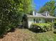 Side view of a house, with partial view of a fence and foliage around the property at 3712 Avalon Ave, Charlotte, NC 28208