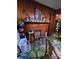 A living room featuring a brick fireplace and wood paneling at 3712 Avalon Ave, Charlotte, NC 28208